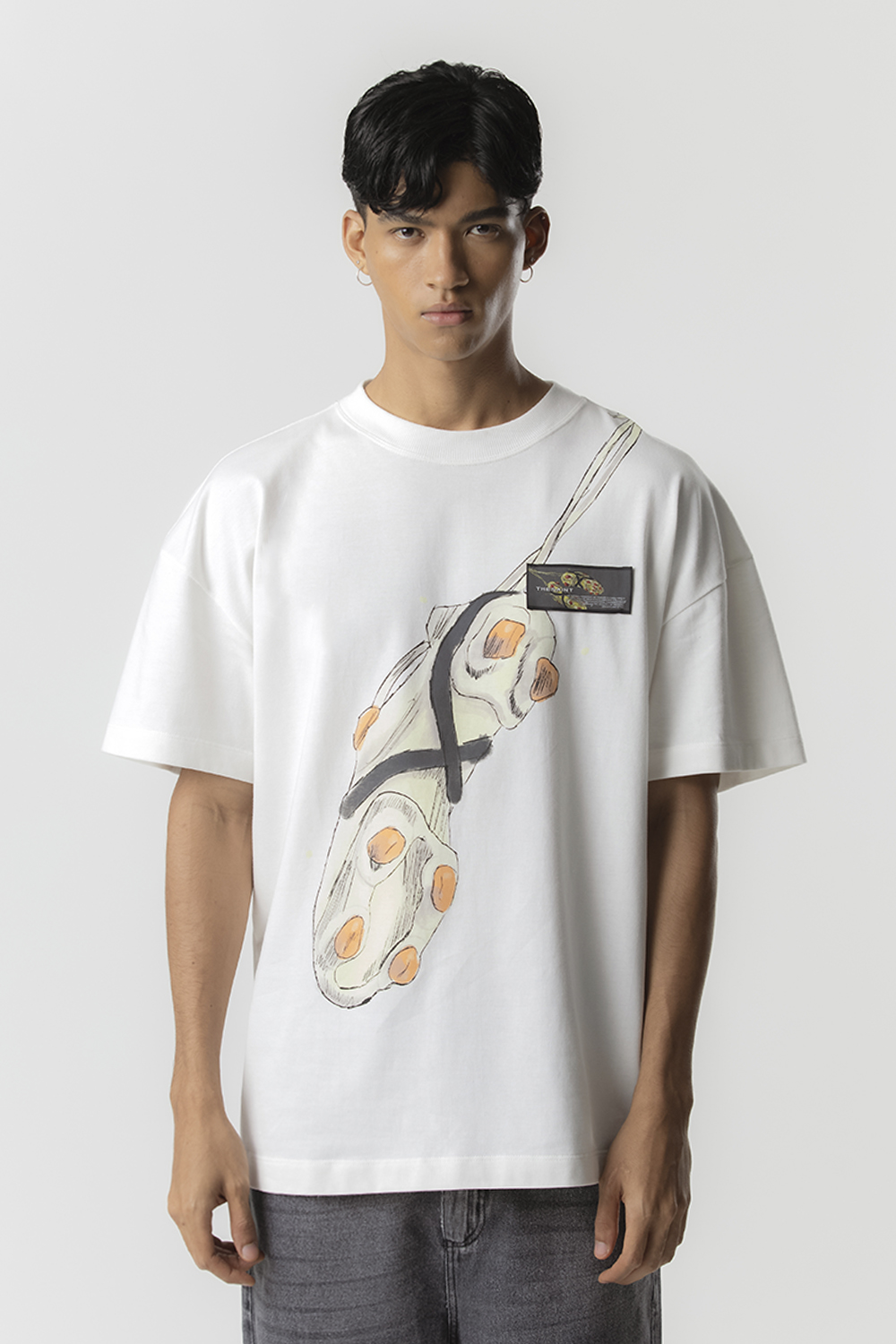 Camiseta TheSaint Oversized Cleats (Off White)